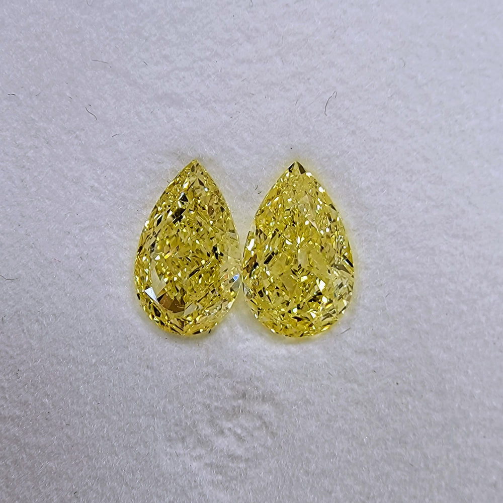 1.30ct & 1.31ct Fancy Yellow Pear Diamonds VS GIA