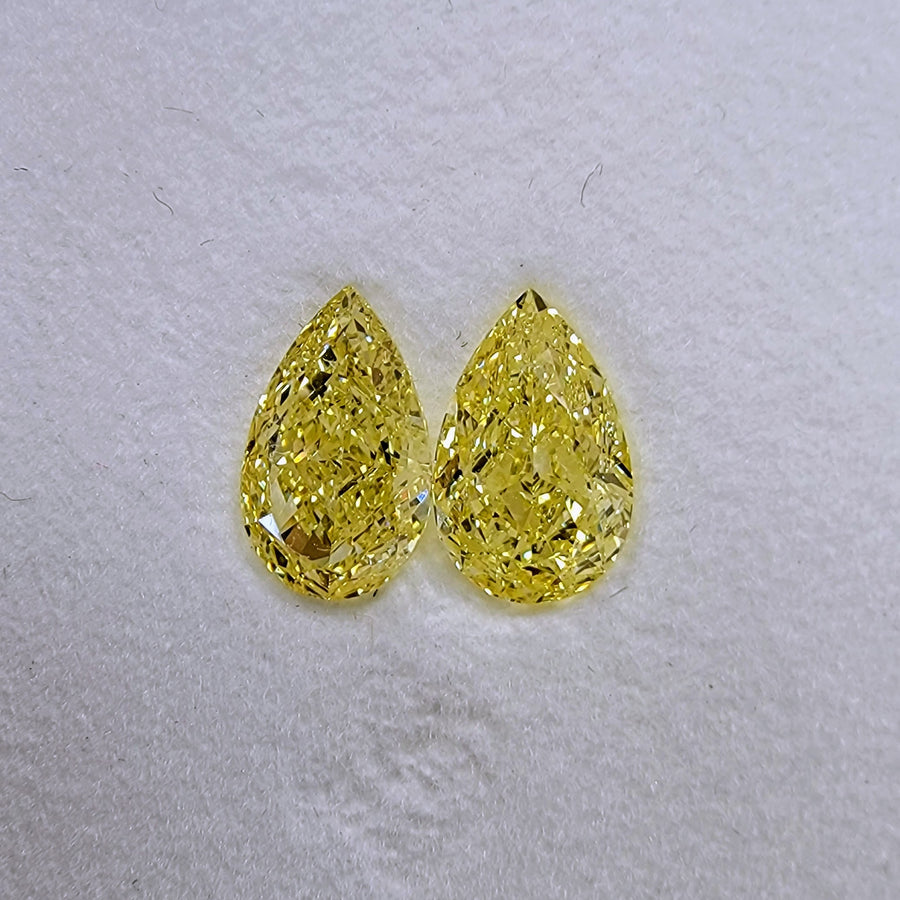 1.30ct & 1.31ct Fancy Yellow Pear Diamonds VS GIA
