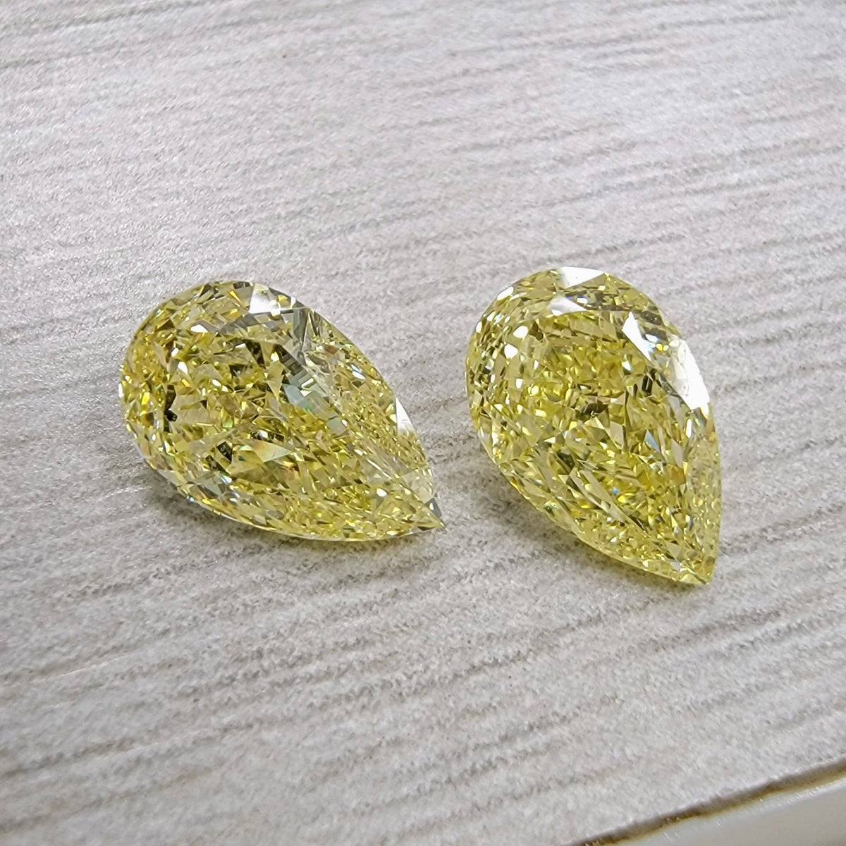 1.30ct & 1.31ct Fancy Yellow Pear Diamonds VS GIA