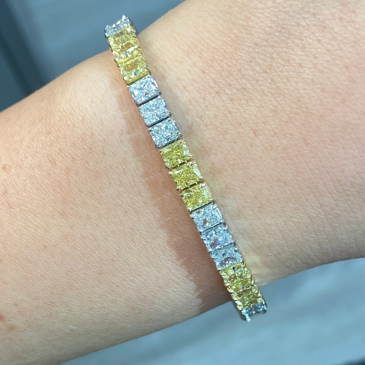 14.97ctw Fancy Intense Yellow Diamond and White Radiant Diamond Tennis Bracelet