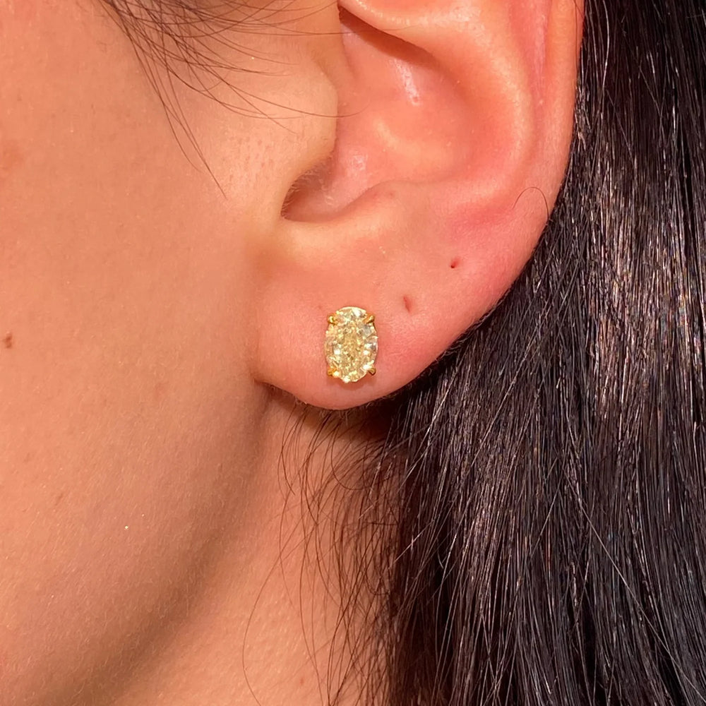 2.33ctw Light Yellow Oval Diamond Stud Earrings GIA