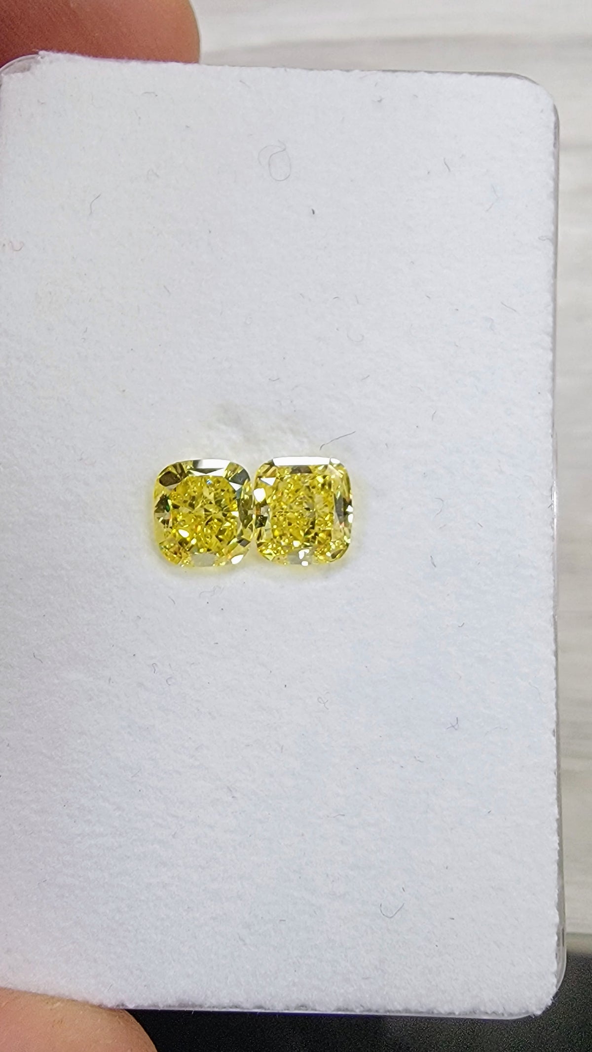 1.02ct & 1.02ct Fancy Vivid Yellow Cushion Diamonds GIA