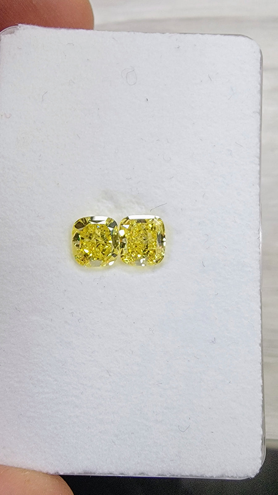 1.02ct & 1.02ct Fancy Vivid Yellow Cushion Diamonds GIA