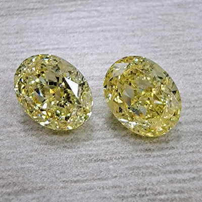 1.09ct & 1.02ct Fancy Yellow Ovals VS GIA
