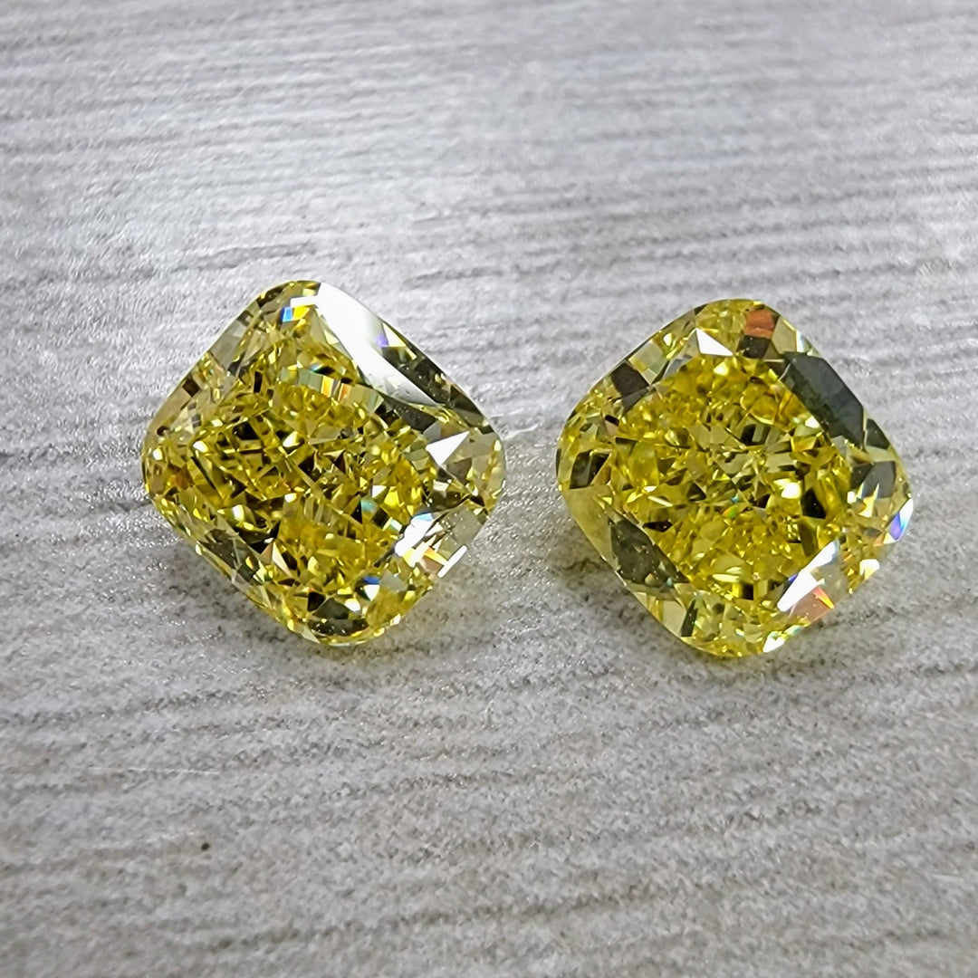 Matched Pair Fancy Vivid Yellow Cushion Diamonds GIA