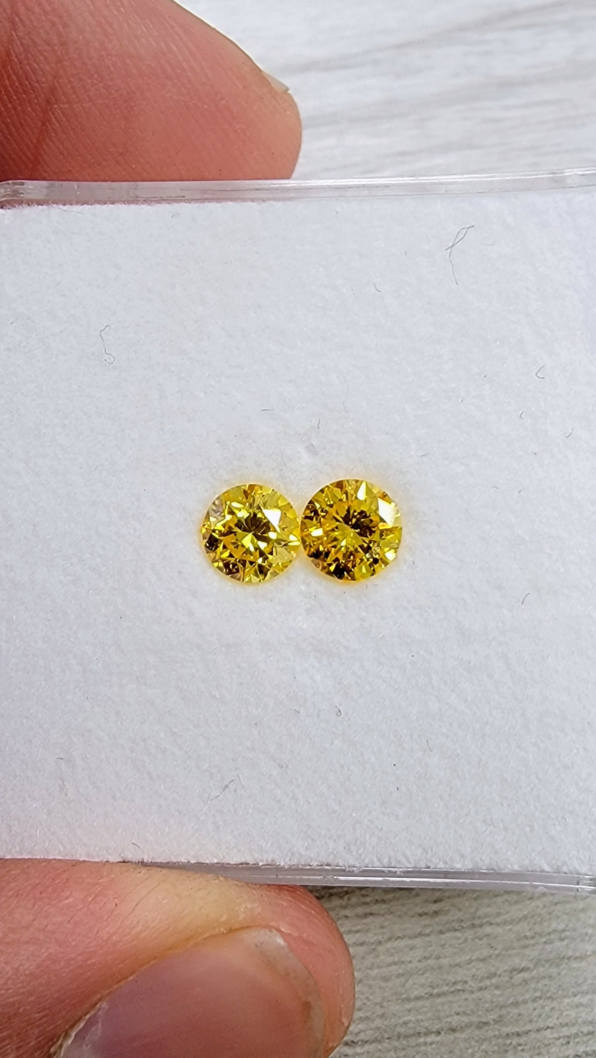 0.50ct & 0.50ct Fancy Vivid Yellow Round Diamonds I1 GIA