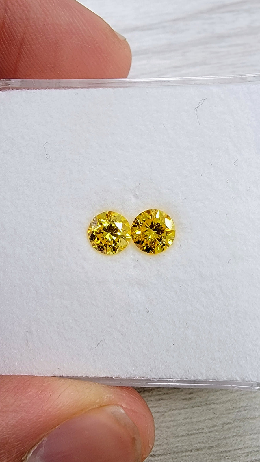 0.50ct & 0.50ct Fancy Vivid Yellow Round Diamonds I1 GIA