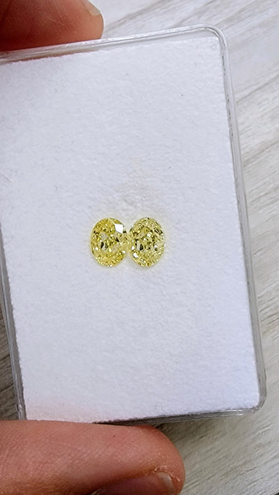 1.09ct & 1.02ct Fancy Yellow Ovals VS GIA