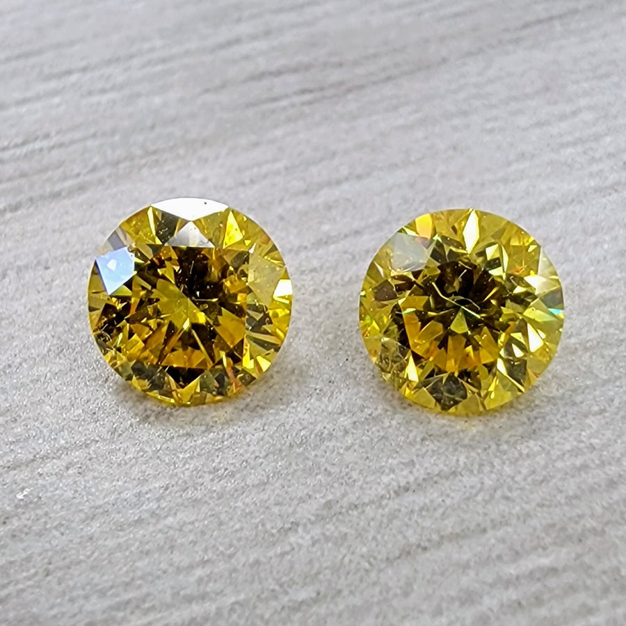 0.50ct & 0.50ct Fancy Vivid Yellow Round Diamonds I1 GIA