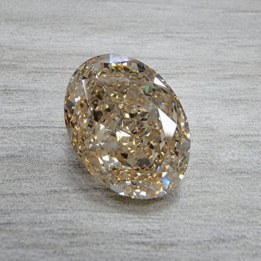 10.12ct Fancy Light Yellow-Brown Oval VS1 GIA