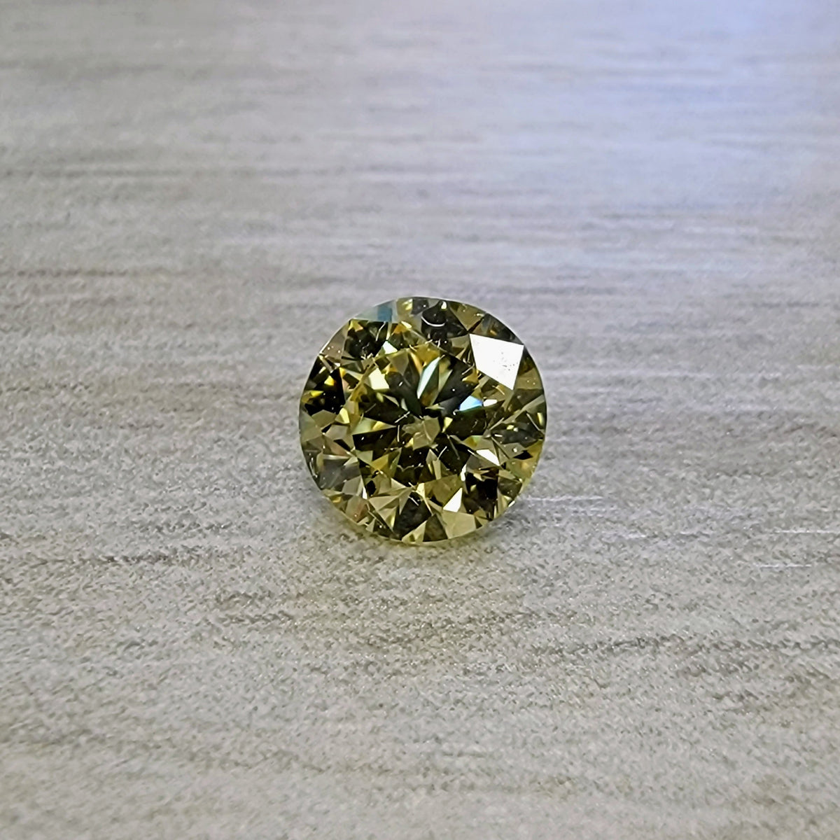 0.60ct Fancy Yellow Round Diamond SI1 GIA