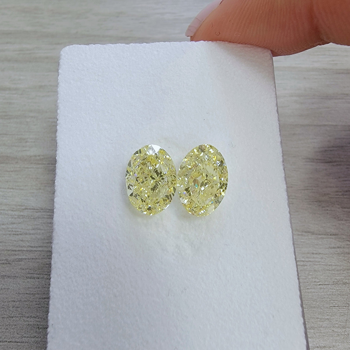 3.00ct & 3.00ct Fancy Light Yellow Oval Diamonds GIA