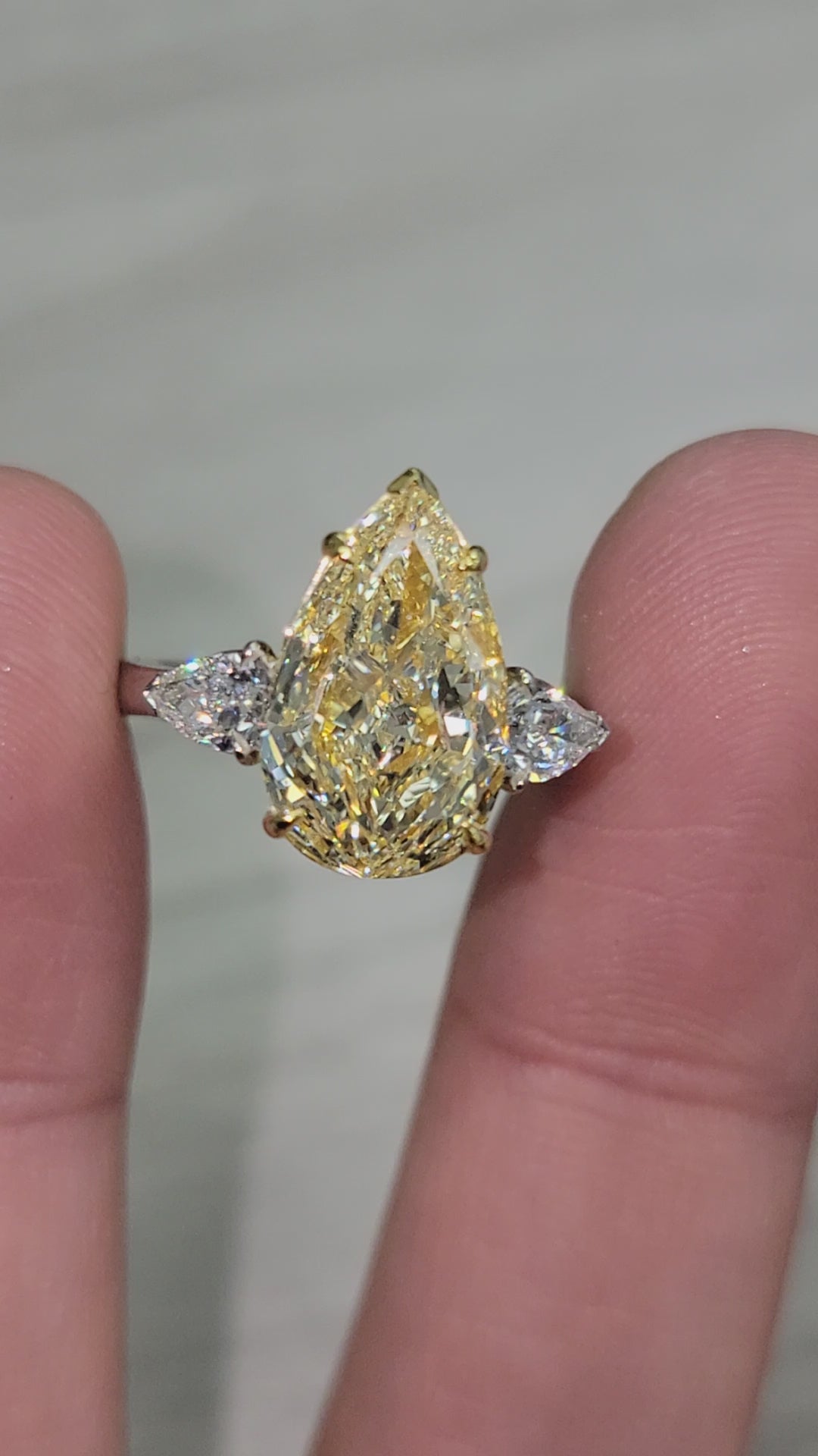 4.01ct Light Yellow Pear VVS1 GIA Three Stone Ring