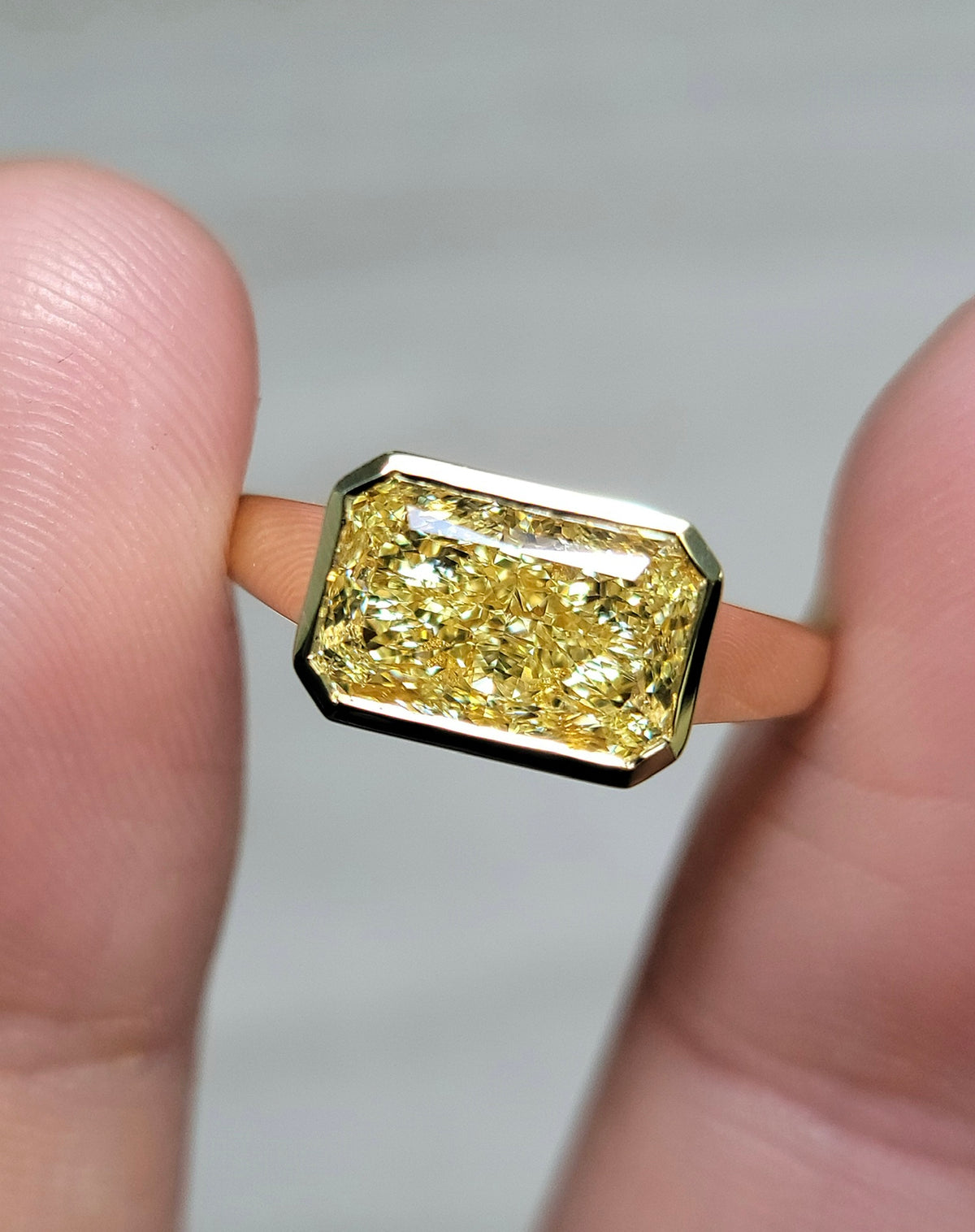 3.01ct Fancy Light Yellow Radiant Diamond East West Bezel Ring VVS2 GIA